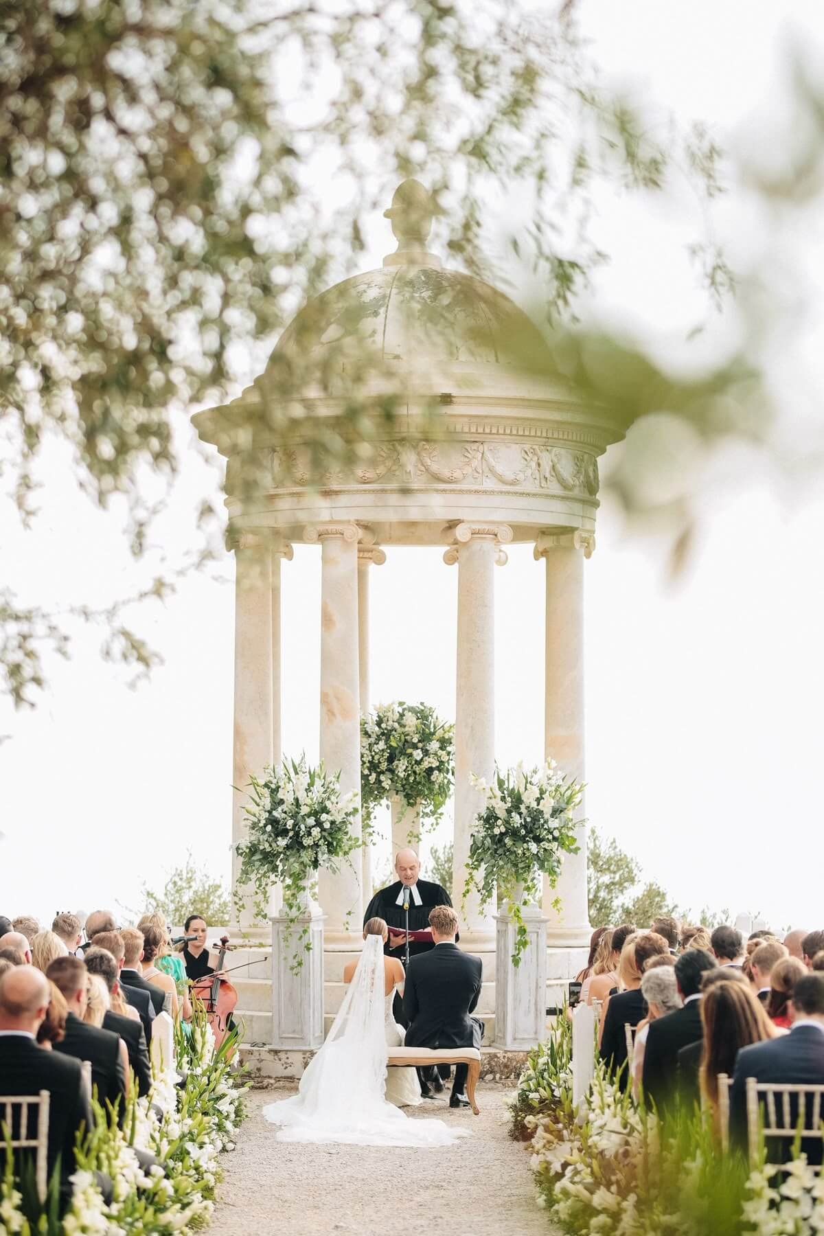 Pinterest / Source: https://www.pinterest.com/mihoci/ Outdoor ceremony at Son Marroig with guests seated before the marble rotunda, beautifully capturing the essence of Mallorca Wedding Venues