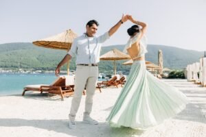 Photo of happy couple dancing at their wedding at a beach shot by Bali Wedding Photographer In The Fable