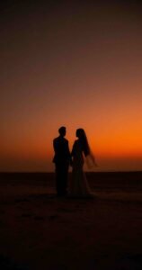 goa wedding photographer: bride and groom photoshoot by the beach; a play of shadows and light in a beach setting in Goa, India