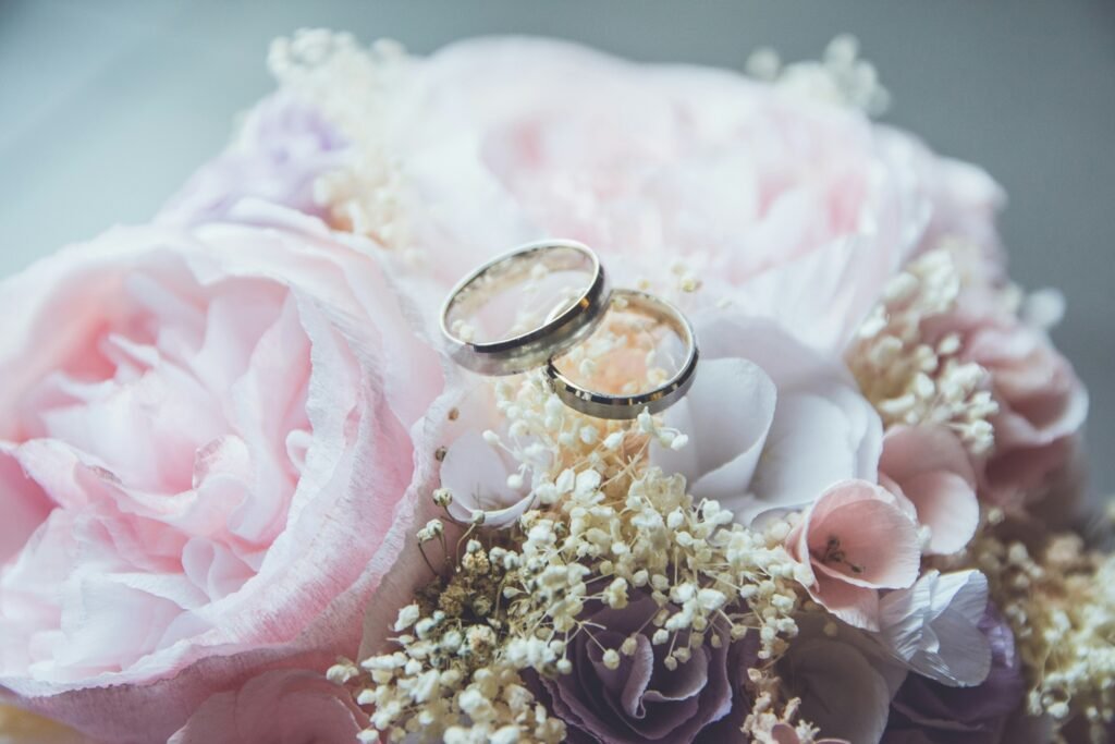 Wedding rings on soft floral arrangement, inspired by best weeding venues in Sorrento, Italy.