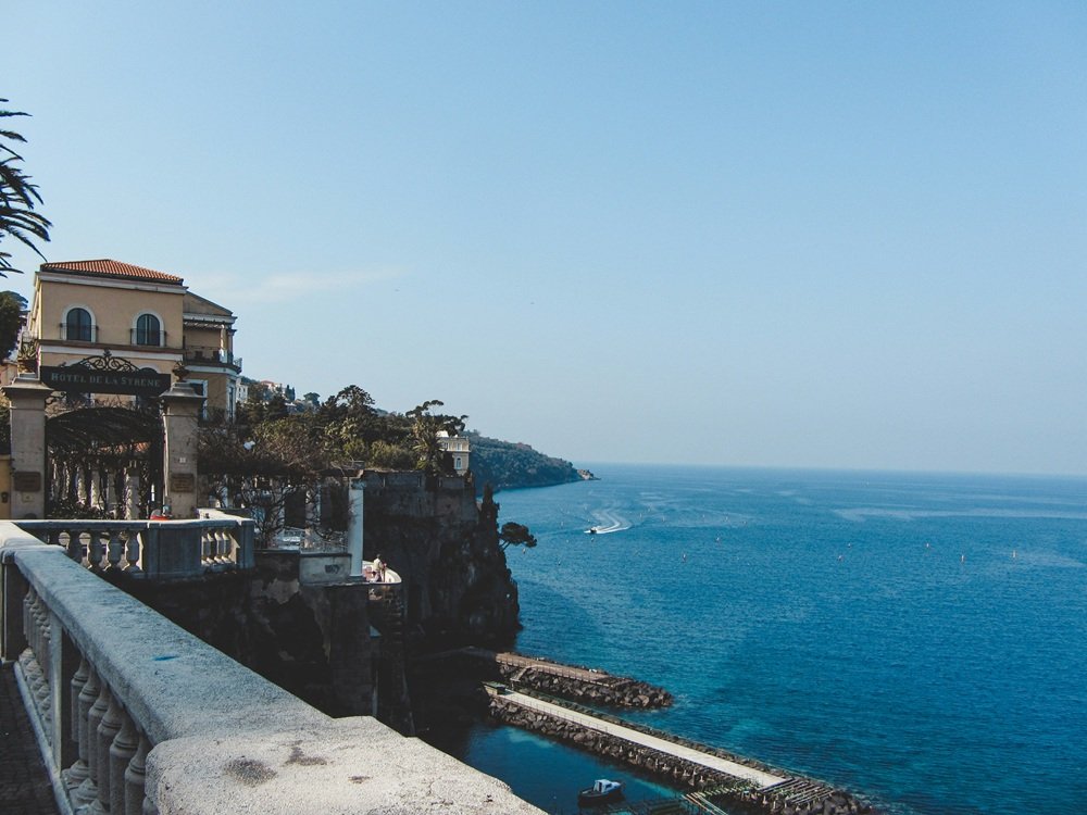 Cliffside hotel terrace overlooking the Bay of Naples in Sorrento, Italy.