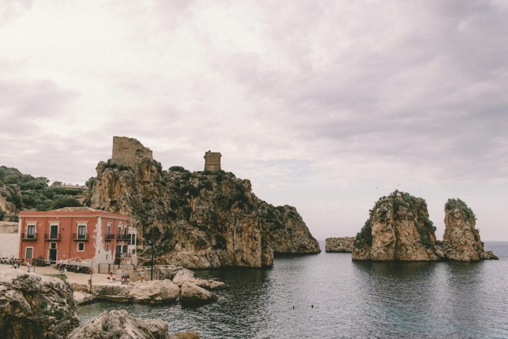 Wedding venues in Sicily Italy - Historic Tonnara di Scopello seaside wedding venue with faraglioni sea stacks in Sicily, Italy.