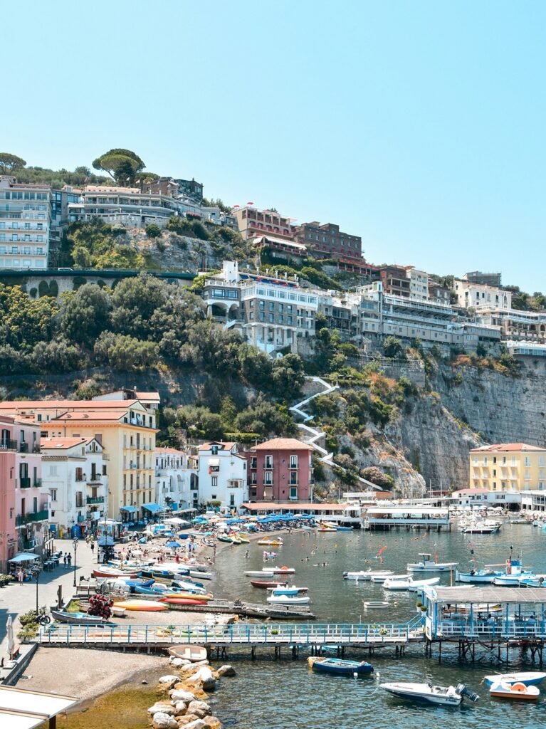 Wedding venues in Sorrento Italy overlooking Marina Grande with colorful houses and boats along the coastline.