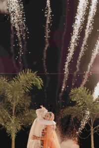 Indian wedding photographer in Thailand: An Indian couple getting married by the fireworks in Thailand