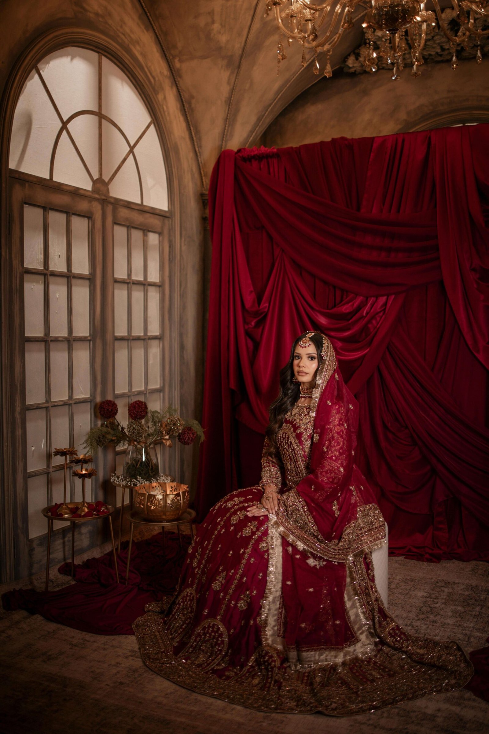 best wedding photographers in Delhi NCR - portrait of a bride in a red bridal attire shot by a wedding media production team